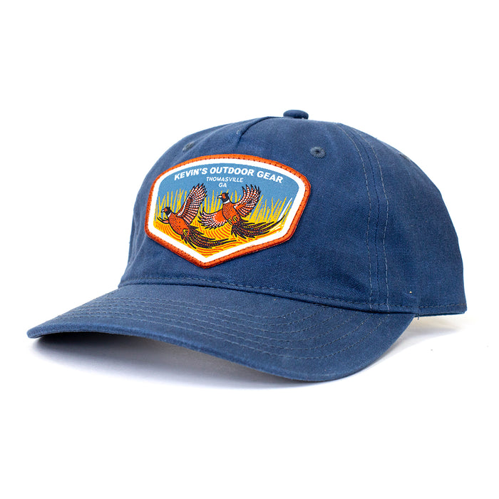 Navy blue waxed cotton five-panel cap featuring a colorful pheasant patch by Casey Underwood.