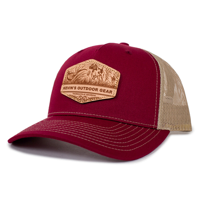 Maroon Richardson 112 trucker cap with a tan mesh back and a leather etched pointer dog patch on the front.