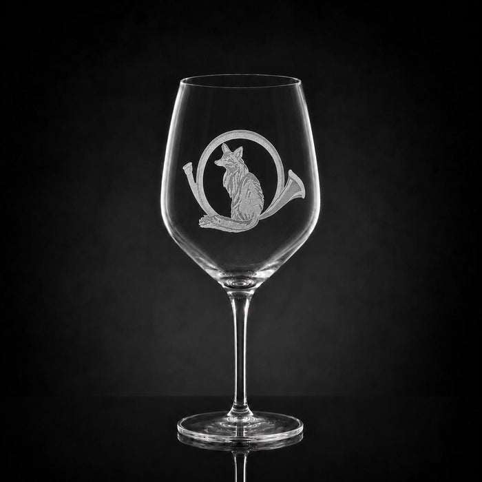 23 oz crystal red wine glass featuring a detailed sand-etched fox and horn design against a black background.