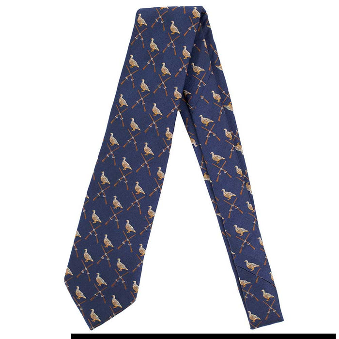 Handmade navy blue English silk tie featuring a repeating pattern of game birds and crossed shotguns.