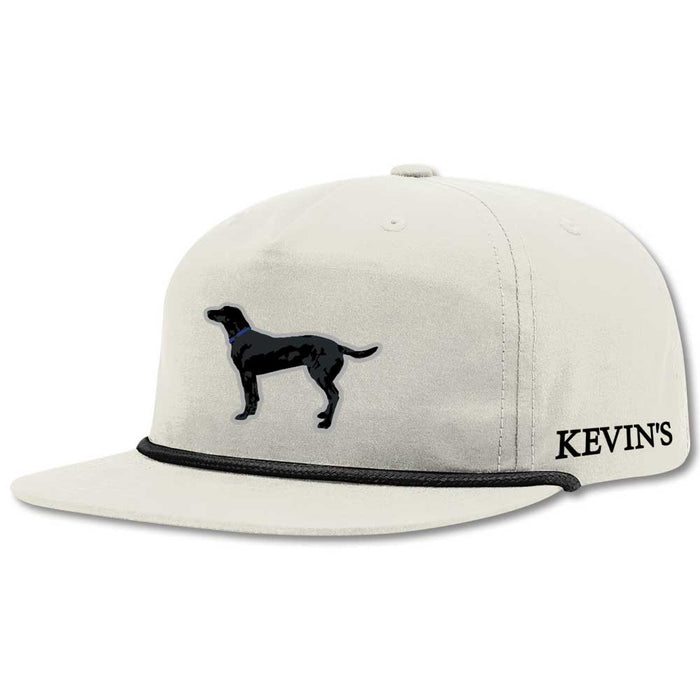 Off-white golf rope cap featuring a black lab graphic, flat visor, and black rope detail with Kevin's logo on the side.