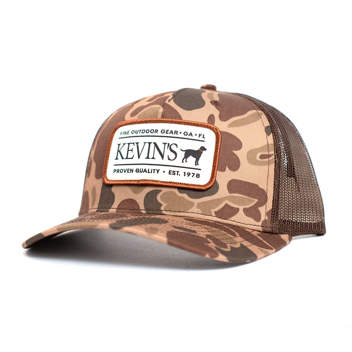 Kevin's Richardson camo trucker cap with brown mesh back, 5-panel twill design, and branded outdoor patch.