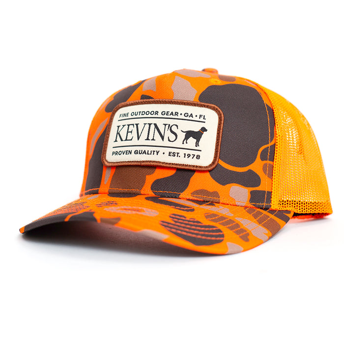 Kevin's Richardson 5-panel trucker cap in orange camo with a breathable mesh back and branded outdoor patch.