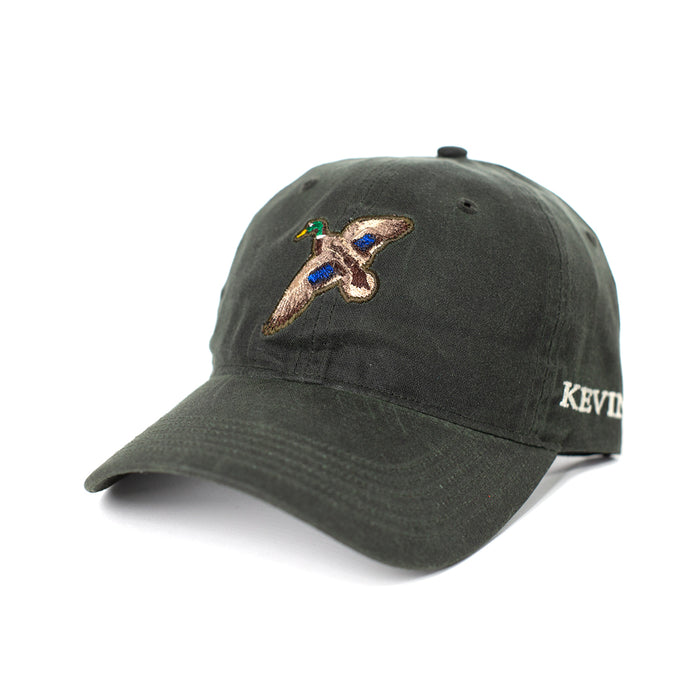 Dark green waxed cotton cap with an embroidered mallard duck and Kevin’s logo on the side.