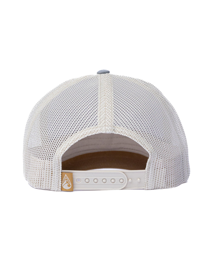 Rear view of the Waihana Lagoon Diver Trucker hat in denim, showing the white mesh back panels, snapback closure, and gold Waihana brand label.