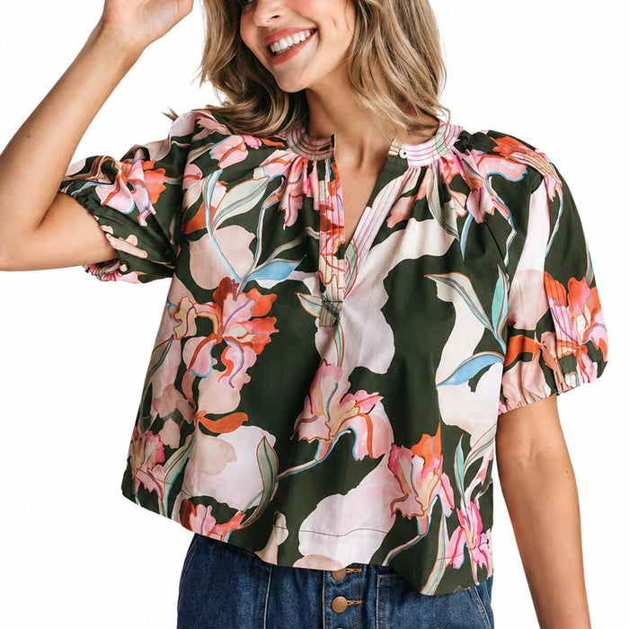 LaRoque cotton poplin Henley top with olive green floral print, open neckline, and draped sleeves with elastic cuffs.