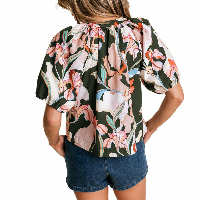 LaRoque cotton poplin Henley top in dark green with a pink floral print, featuring draped sleeves and elastic cuffs.