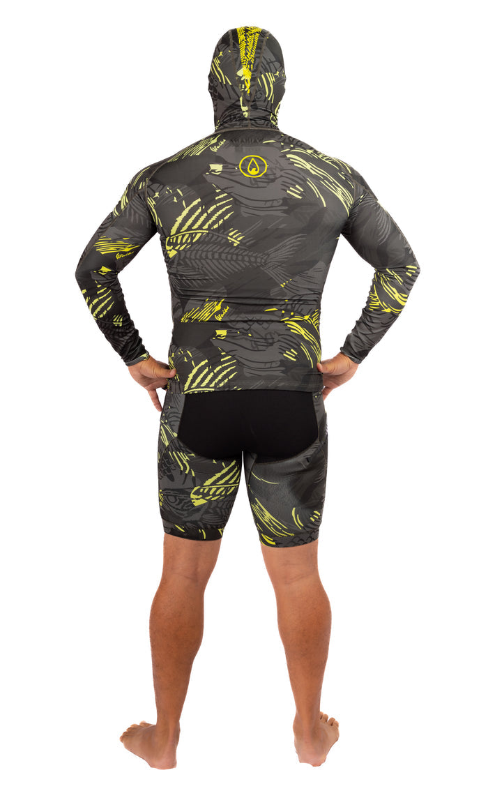 Back view of a male model wearing the Waihana Lime Fishbone Hooded Spearfishing Rashguard in dark grey and yellow-green fishbone print, paired with matching shorts, on a white background.