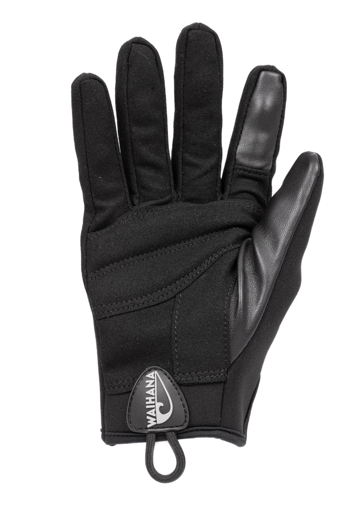 Waihana Maritime Tactical Glove in black displayed palm-side up, featuring leather reinforced palm and thumb, neoprene back, and Waihana logo badge at the wrist with a cord loop pull tab.