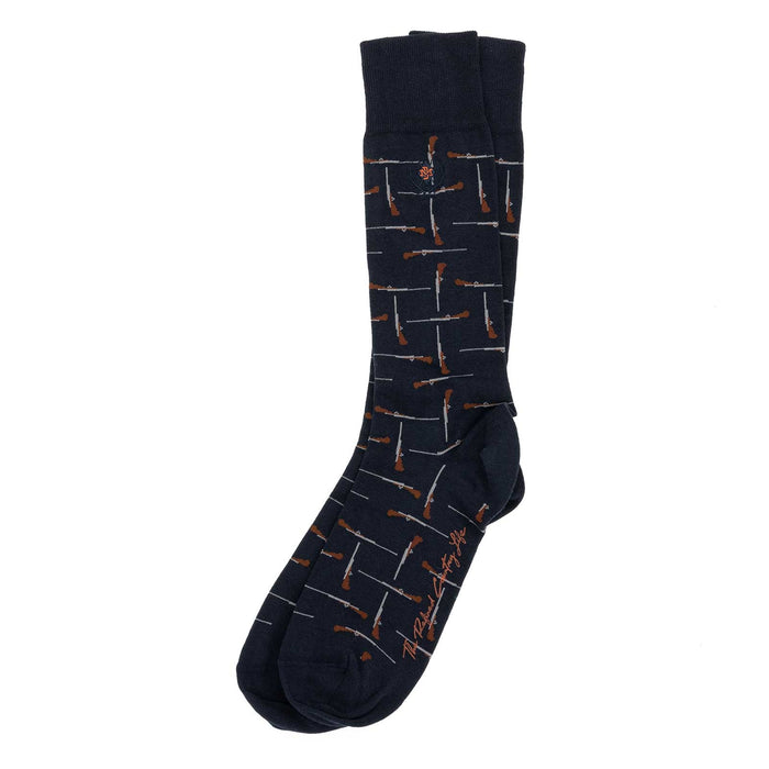 Navy blue boot-length Peruvian Pima cotton socks featuring a repeating shotgun pattern and Martin Dingman branding.