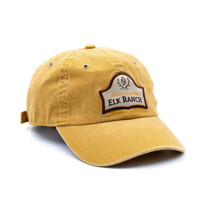 Mustard yellow cotton twill 6-panel country cap with an Elk Ranch patch and brass eyelets.