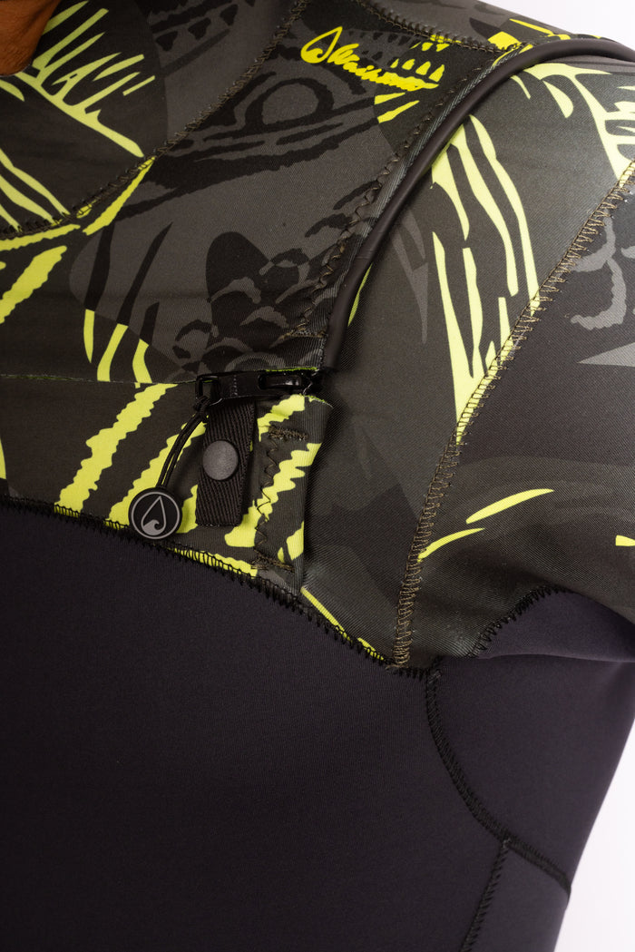 Close-up of the chest zip closure and Waihana brand logo on a men's lime fishbone patterned neoprene surf spring suit.