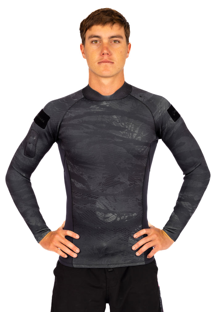 Male model wearing the Waihana Men's Tropicam Black rear-zip surf rashguard top, featuring a dark grey camouflage neoprene print, long sleeves, and Waihana branded arm patches, shown from the front against a white background.