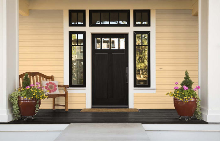 Retique It wood finish kit with smooth black exterior top coat and gloss, shown on a front door for a sleek, polished look.
