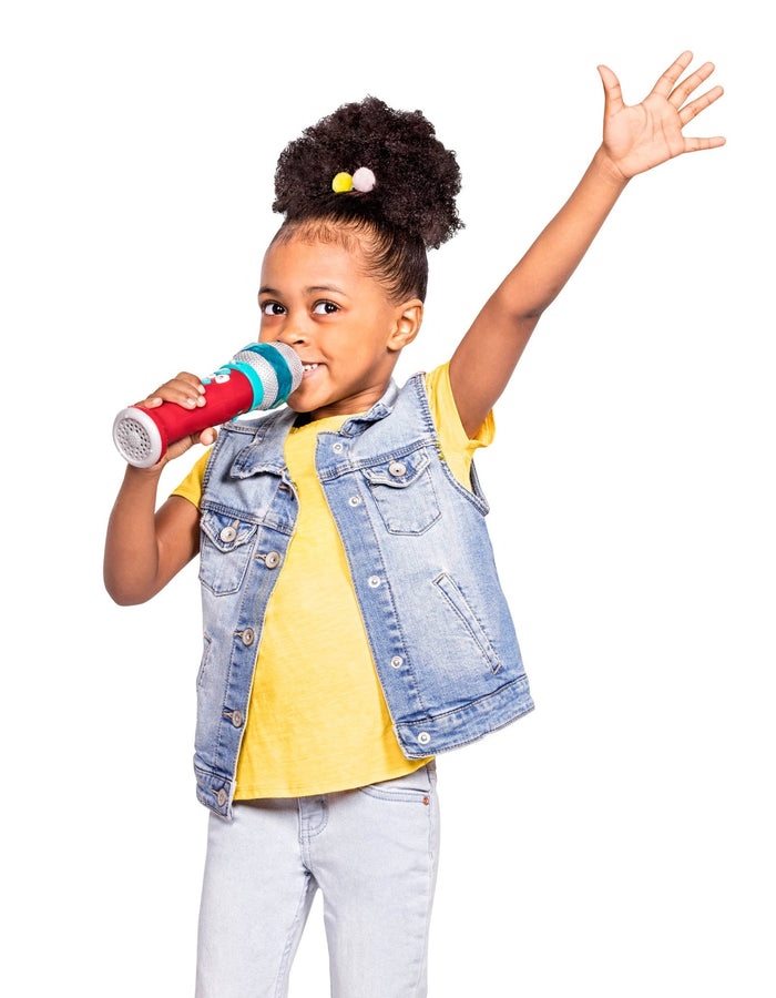 A red microphone toy for toddlers and kids.IA child playing with a toy microphone.