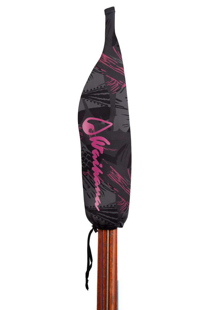 Waihana Neoprene Protective SpearSock in Pink Fishbone pattern — black and pink tropical fish graphic print with cursive Waihana logo — fitted over a wooden pole spear shaft.