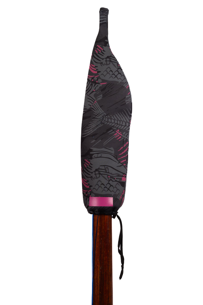 Waihana Neoprene Protective SpearSock in Pink Fishbone pattern covering the blade of a wooden pole spear, shown on a white studio background.