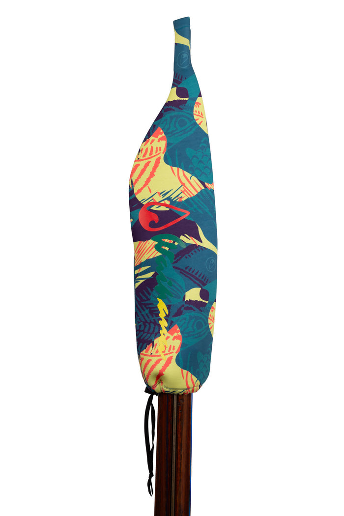 Waihana neoprene protective spear sock in a vibrant Goliath Grouper tropical fish print featuring teal, yellow, red, and purple tones, shown fitted over a wooden pole spear.