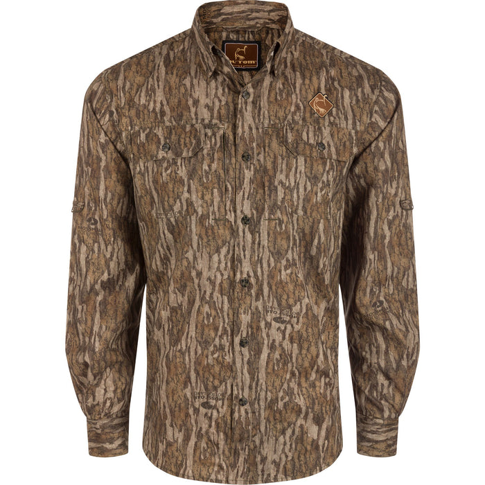 Ol' Tom long-sleeve performance camo shirt in Mossy Oak pattern with button-down collar and dual chest pockets.