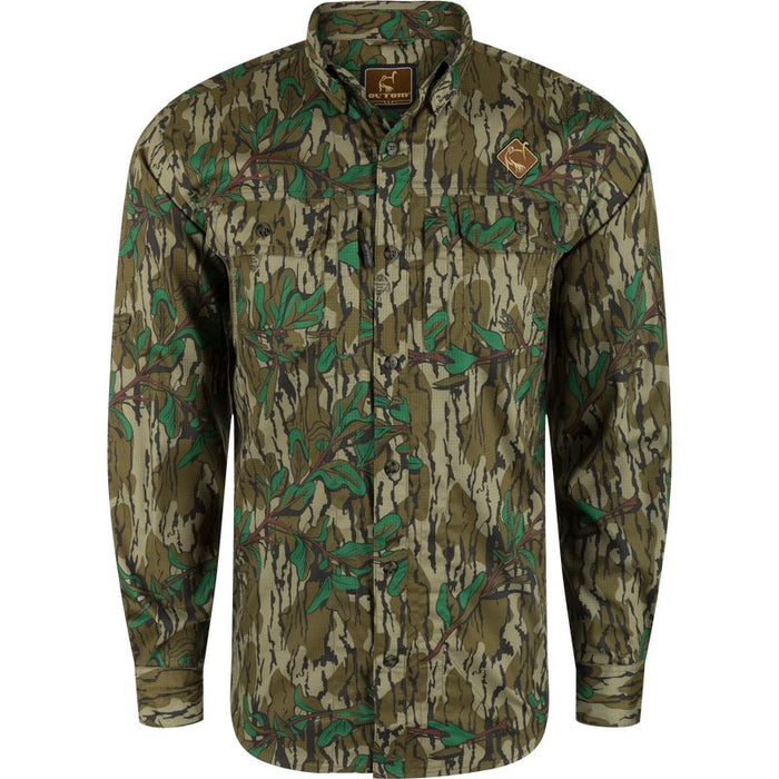Youth Ol' Tom long-sleeve camo hunting shirt with dual chest pockets, button-down collar, and moisture-wicking performance fabric.