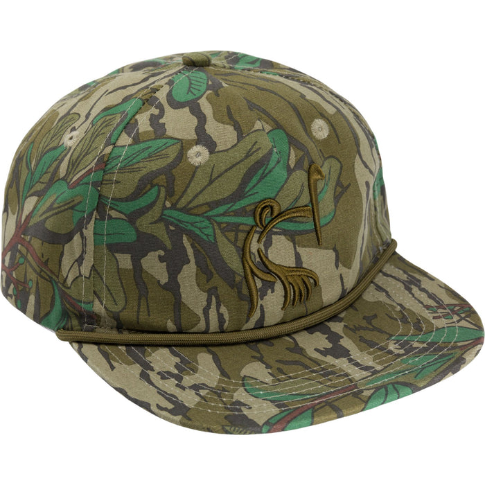 Ol' Tom X Lost Hat camo cap with green leaf pattern, 550 paracord detail, and embroidered logo on a mid-crown silhouette.