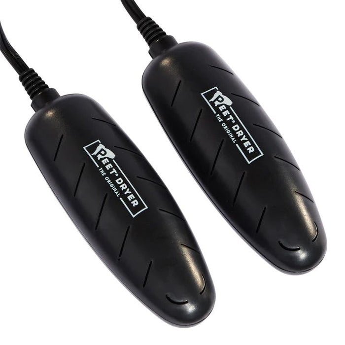 Two black, sleek, portable Peet Power Cell shoe dryer inserts with ventilation slits and power cords on a white background.