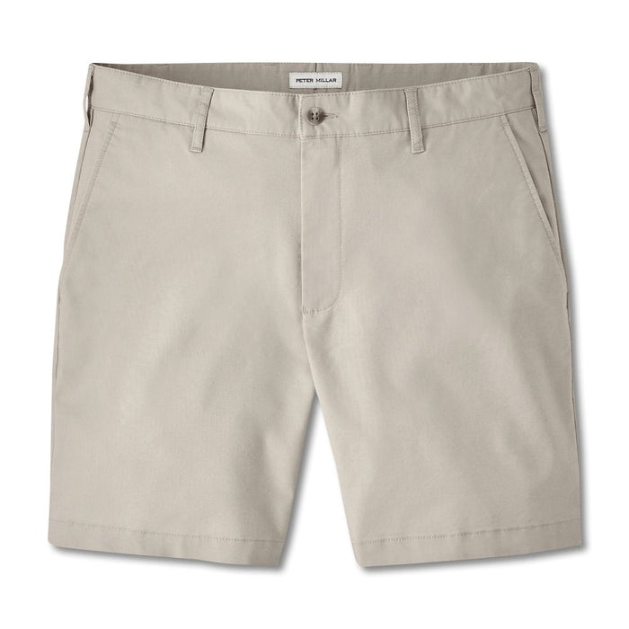 Peter Millar Crown Comfort beige plain weave shorts with an 8-inch inseam and button-front closure.
