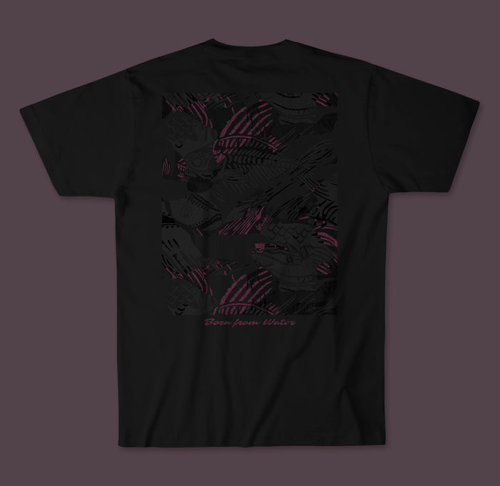 Back of a black Waihana Pink Fishbone Premium Pima T-Shirt showing a large dark-toned fish graphic with pink linework and 'Born from Water' script text.