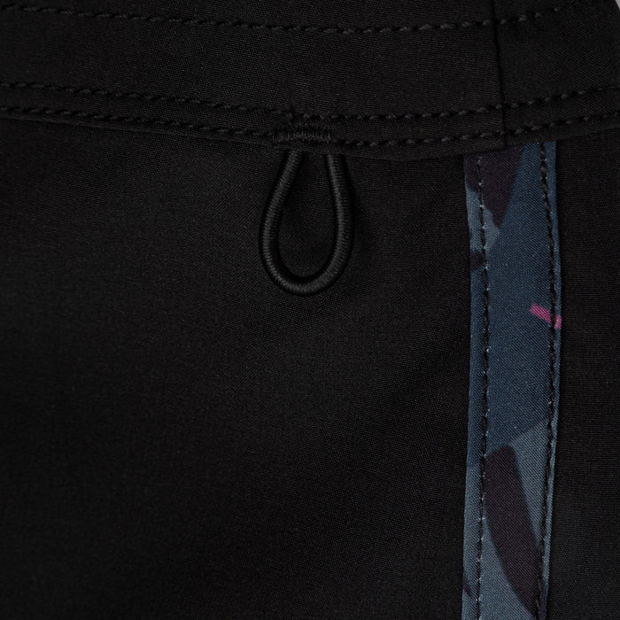 Close-up of Waihana Pink Fishbone W1 board shorts showing the bungee loop closure detail and a dark camouflage side panel accent with pink highlights.