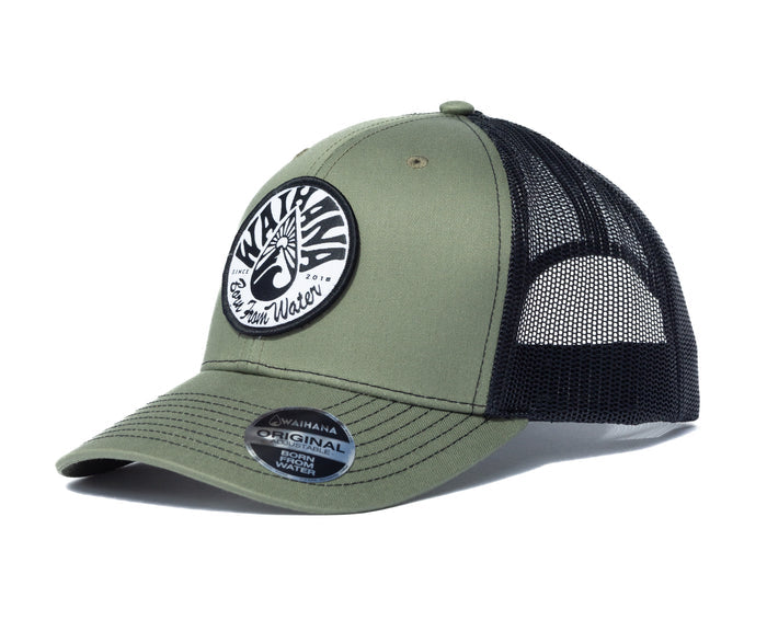 Waihana Ranger Green Mauka Trucker hat featuring an olive green structured front, black mesh back panels, and a circular black-and-white woven Waihana logo patch, shown on a white background.