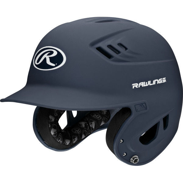 The Rawlings Velo Matte Batting Helmet: R16M features a matte navy finish, ear protection, ventilation holes, visible interior padding, and white Rawlings logos—perfect as a youth baseball helmet.