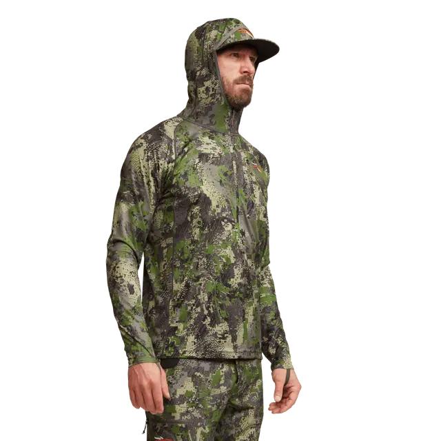 Sitka Core Lightweight Hoody in camo print with a fitted hood, long sleeves, and thumb loops for hunting.