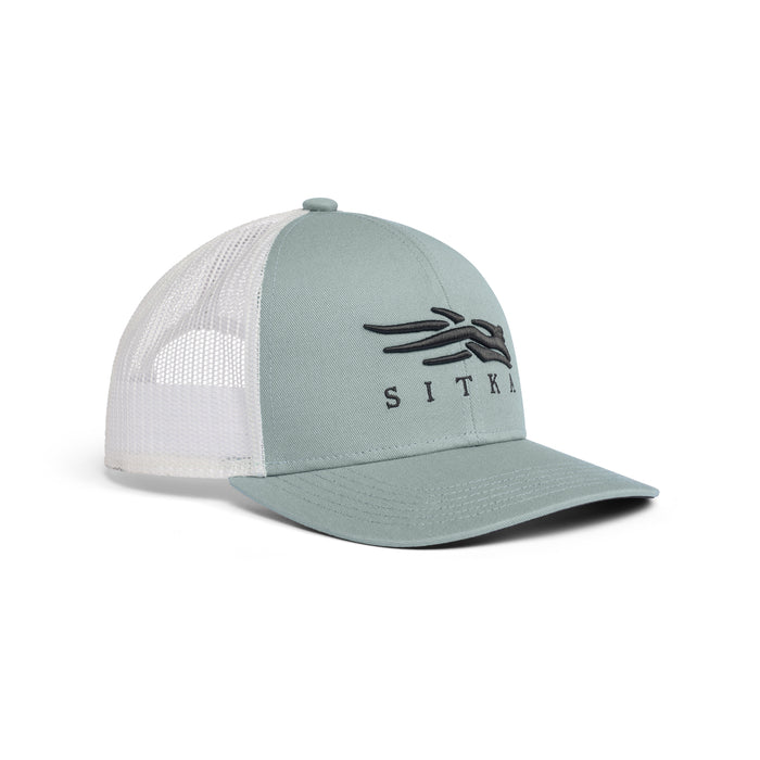Sage green Sitka Icon Mid Pro trucker cap with a white mesh back, structured cotton twill front, and black logo embroidery.