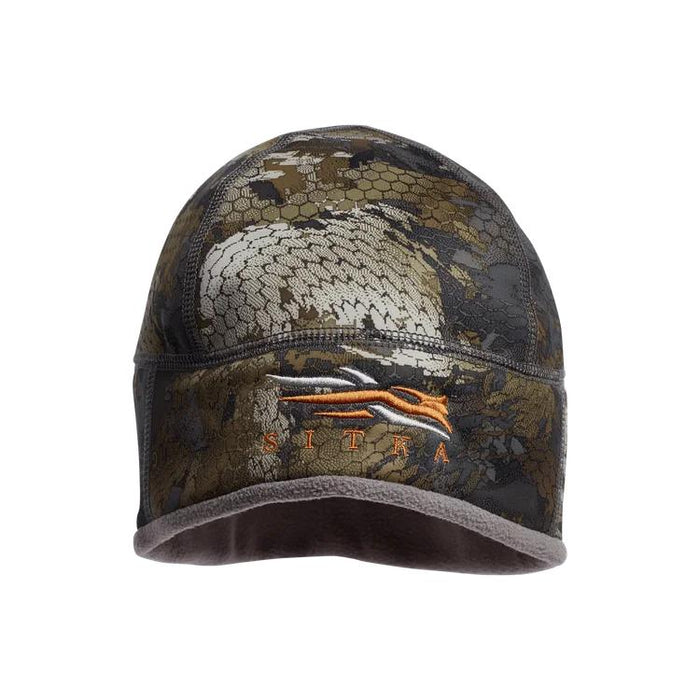 Sitka Jetstream windproof beanie in camo pattern with orange logo embroidery and soft grey fleece lining.