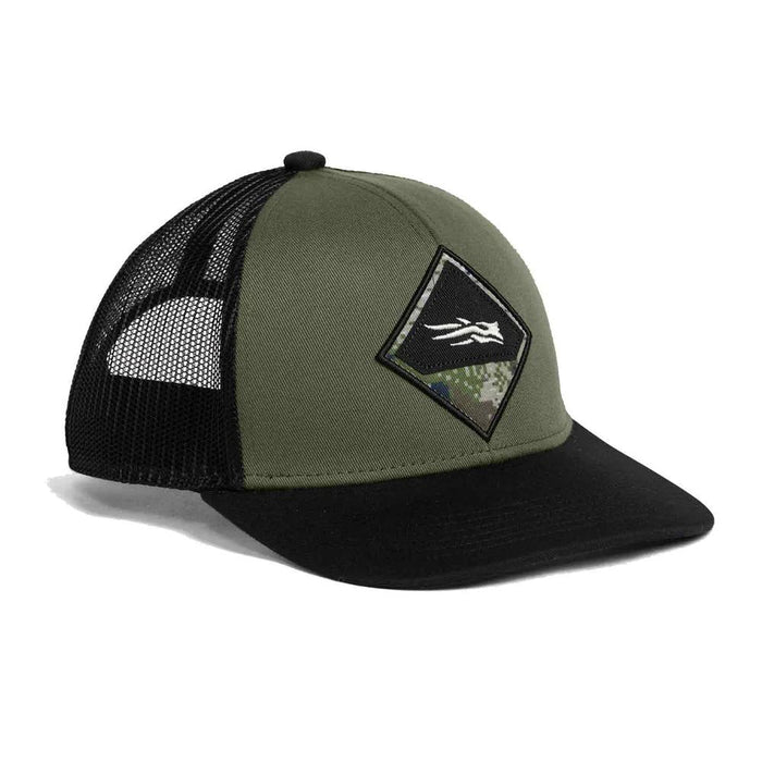 Olive and black Sitka Mid Pro trucker hat with a diamond-shaped Subalpine camo badge and mesh back.