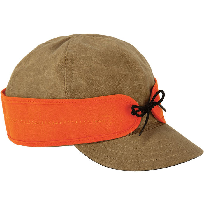 Stormy Kromer waxed cotton cap in brown with a high-visibility orange pulldown earband and black tie detail.