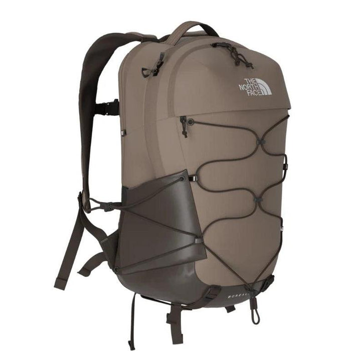 Taupe The North Face Borealis backpack with front bungee cord system, dark brown accents, and ergonomic shoulder straps.