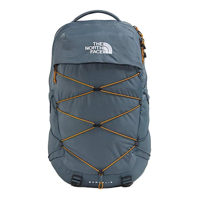 The North Face Borealis backpack in slate blue with orange bungee cord straps and a white logo on a white background.