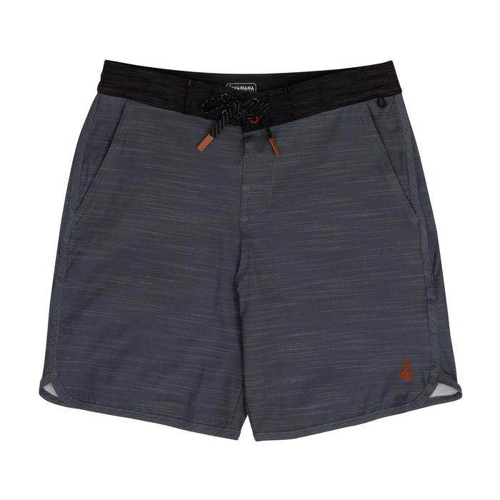 Waihana Tidal Moss Cruiser board shorts laid flat on a white background, featuring a dark charcoal heathered fabric, black contrast waistband, braided drawstring with orange tips, and an embroidered Waihana logo on the lower leg.