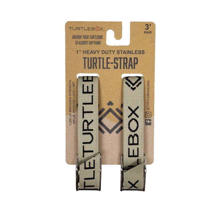 Two olive green Turtlebox tie-down straps with black branding and heavy-duty stainless steel buckles on retail packaging.