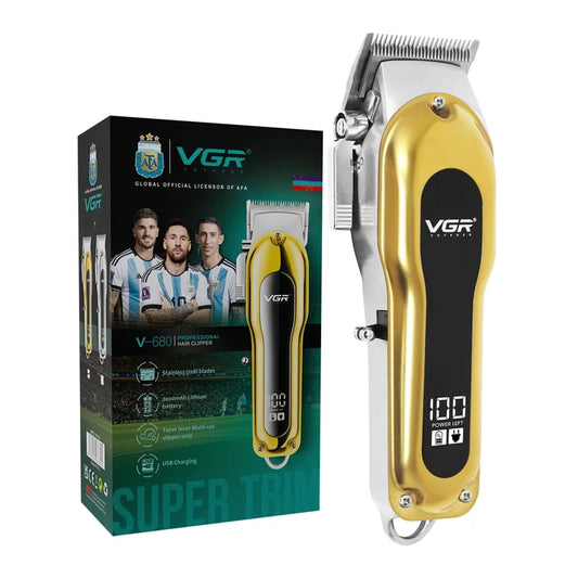 Gold and black hair clipper with VGR branding next to its packaging