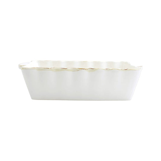 Vietri medium rectangular stoneware baker in white with scalloped edges and a rustic, handcrafted finish.