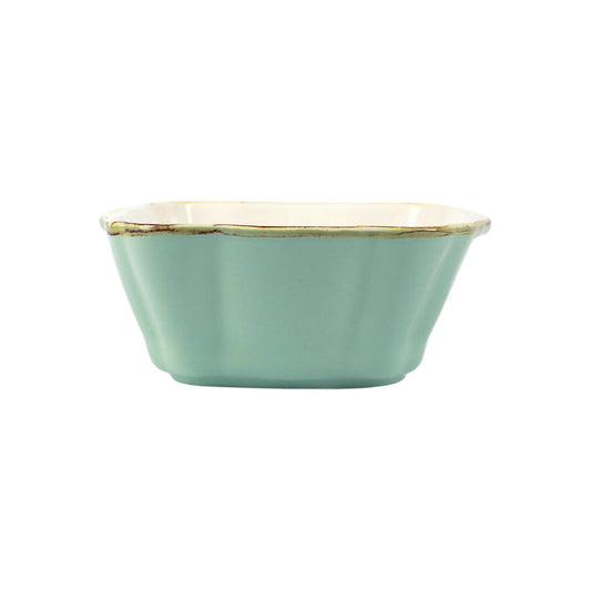 Small square Italian stoneware baker in sage green with scalloped edges and a rustic, handcrafted finish.