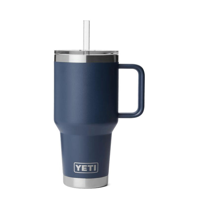 Navy blue YETI Rambler 35 oz mug with a handle, clear straw lid, and stainless steel base on a white background.