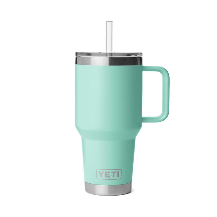 Seafoam green YETI Rambler 35 oz insulated mug with a sturdy handle, clear straw lid, and stainless steel base.