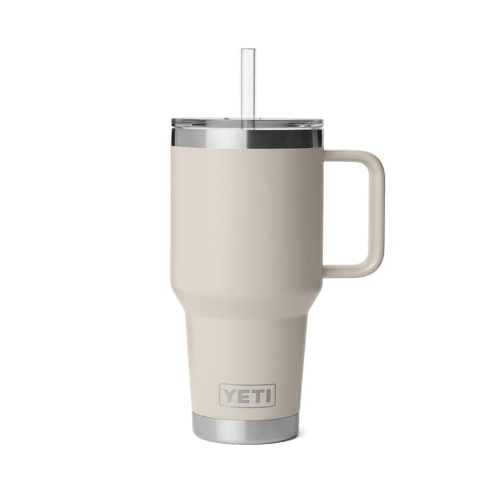 Sand-colored YETI Rambler 35 oz insulated mug with a handle, straw lid, and stainless steel base on a white background.