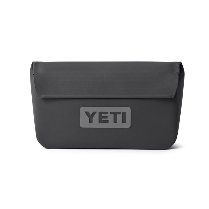 Charcoal grey YETI Sidekick Dry 1L waterproof gear case with a magnetic fold-over closure and embossed logo.