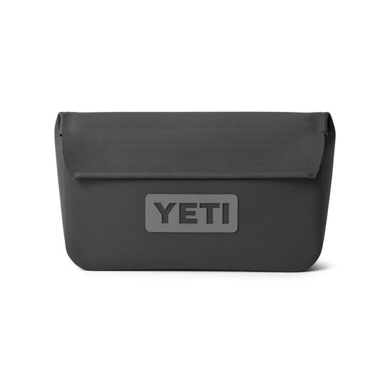 Charcoal grey YETI Sidekick Dry 1L waterproof gear case with a magnetic fold-over closure and embossed logo.