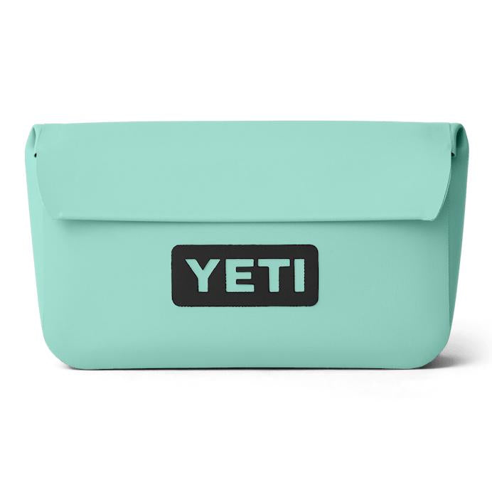 Light blue YETI Sidekick Dry 1L waterproof gear case with a black logo patch and durable, smooth exterior finish.