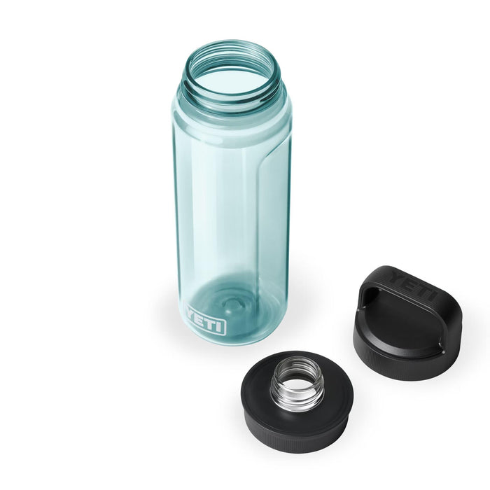 Light blue 25 oz YETI Yonder water bottle made of recycled plastic with a detachable black Chug Cap on white background.